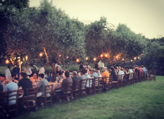 a team dinner at a company retreat in Tuscany
